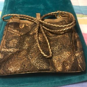 Tianni leather and canvas gold bag. Excellent condition.!!!!